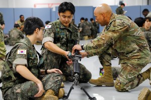 A former Korea Augmentation to the U.S. Army (KATUSA) soldier function checks a weapon for a mobilization exercise (MOBEX) at Camp Humphreys, South Korea, Aug. 27, 2025. The MOBEX is to provide former KATUSAs, who are now in an inactive reserve status, their mandatory annual training. For a week, the KATUSAs go through basic marksmanship training, first aid, military policy and chemical, biological, radiological and nuclear threat training. The training is conducted by 2nd Infantry Division, ROK-US Combined Division Soldiers. The event is part of Ulchi Freedom Shield 25, an annual exercise designed to strengthen the combined defense posture and Republic of Korea-U.S. alliance response capabilities based on scenarios that reflect diverse threats within the security environment. The rigorous training will ensure the alliance is ready to defend the Republic of Korea and promote security in Northeast Asia. (U.S. Army photo by Pfc. Wilfred Salters.)